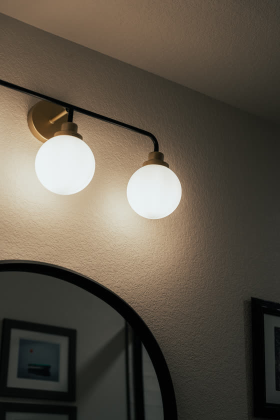 Modern bathroom light fixture above a vanity